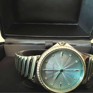 Tiffany Metro 2-Hand 28mm Watch with Diamond Bezel and a diamond on the Crown.